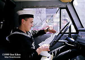 A young Turkish Marine soldier on duty as a driver waits in his jeep and reads letters from home in Ankara, Turkey.