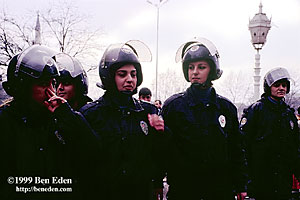 A female Turkish riot police squad wearing helmets and protective gear waits for orders during a crisis over student headscarf wearing at  Istanbul University, Turkey