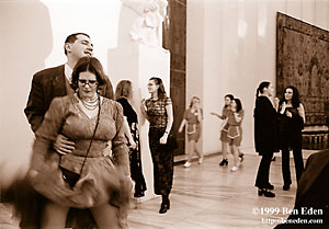 A Jewish young man holds his partner while she lifts her skirt during an impromptu dance at a Chanukah (Hanukah) charity ball held in the Rudolph Gallery at Prague Castle, Czech Republic.