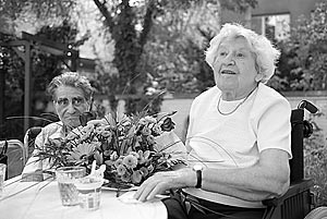 Gertruda Ernstova, a Czech Jewish Holocaust survivor, sits in a wheelchair in the garden of the Charles Jordan retirement home, having just received a birthday bouquet of flowers from a relative in United States.