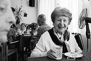 Ruth Kleinova, a Jewish Holocaust survivor, smiles as she has a drink at a birthday celebration in Prague's Charles Jordan retirement home.