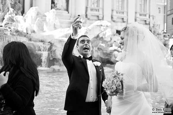 Turkish Newlyweds throwing a coin into the Fontana di Trevi in Rome